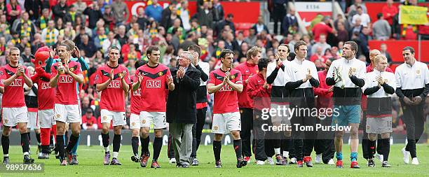 Manager Sir Alex Ferguson of Manchester United and his players appluad the fans on the lap of honour after the Barclays Premier League match between...