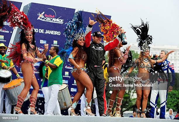 Hannes Arch of Austria celebrates his victory in the Red Bull Air Race Day on May 9, 2010 in Rio de Janeiro, Brazil. Nigel Lamb of Great Britain came...