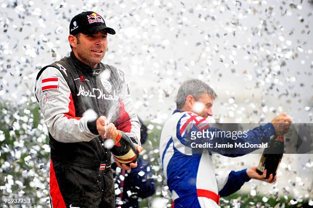 Hannes Arch of Austria celebrates his victory in the Red Bull Air Race Day on May 9, 2010 in Rio de Janeiro, Brazil. Nigel Lamb of Great Britain came...