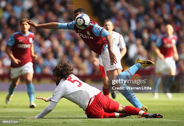 The face of John Carew of Aston Villa is hidden by the ball as he evades a tackle by Gael Givet of Blackburn Rovers during the Barclays Premier...