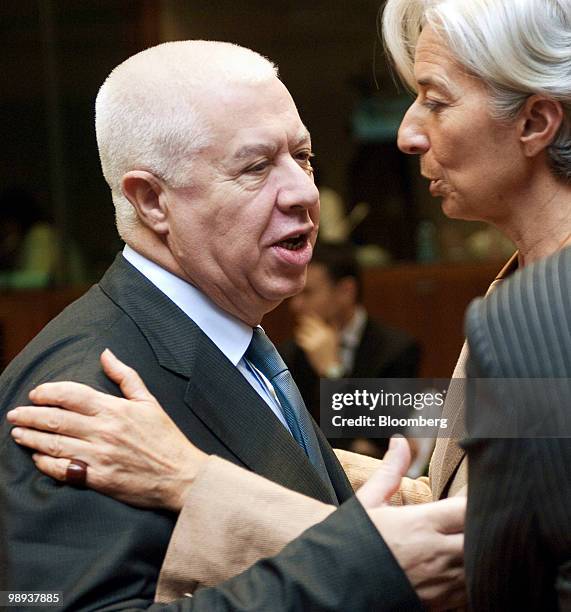 Fernando Teixeira dos Santos, Portugal's finance minister, is greeted by Christine Lagarde, France's finance minister, as he arrives at the emergency...