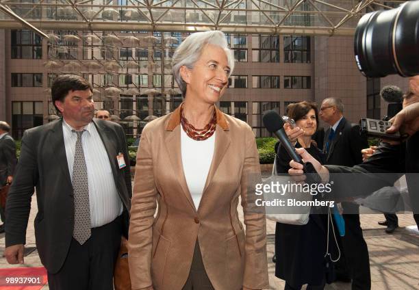 Christine Lagarde, France's finance minister, speaks to the news media as she arrives at the emergency meeting of European Union finance ministers in...