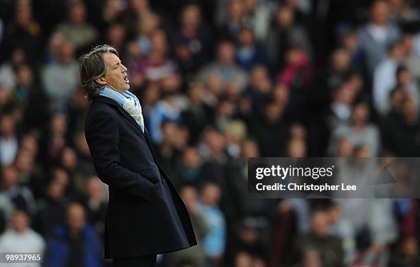 Manchester City manager Roberto Mancini shouts instructions during the Barclays Premier League match between West Ham United and Manchester City at...