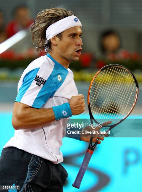 David Ferrer of Spain celebrates a point against Jeremy Chardy of France in their first round match during the Mutua Madrilena Madrid Open tennis...