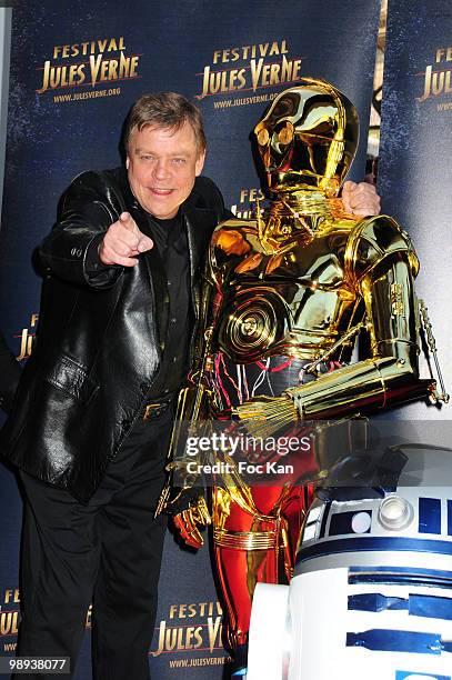 Actor Mark Hamill, "robots" CP03 and R2D2 from "Star Wars" movies attend the Jules Verne 2010 - 18th Adventure Film Festival - Tribute to Star Wars V...