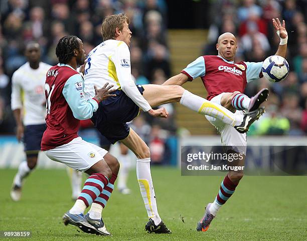 Peter Crouch of Tottenham Hotspur battles for the ball with Tyrone Mears of Burnley during the Barclays Premier League match between Burnley and...