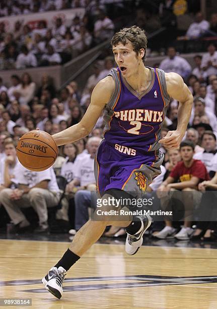 Forward Goran Dragic of the Phoenix Suns dribbles the ball against the San Antonio Spurs in Game Three of the Western Conference Semifinals during...