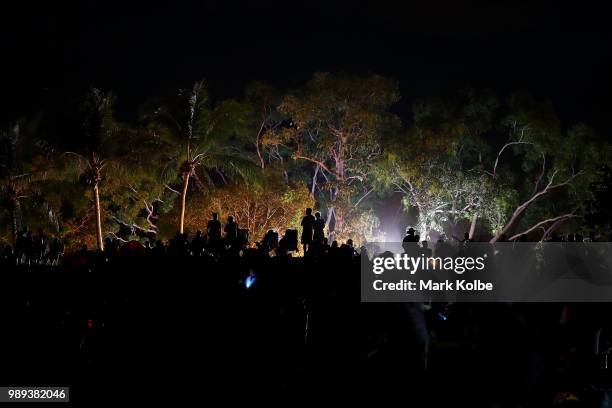 People are seen waiting on the dune overlooking Mindil Beach to watch the fireworks display during Territory Day celebrations at Mindil Beach on July...