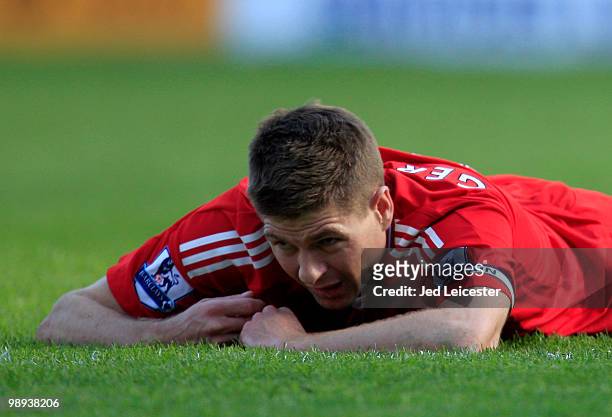 Steven Gerrard of Liverpool lies on the pitch after hitting the post with a shot in the last few minutes during the Barclays Premier League match...