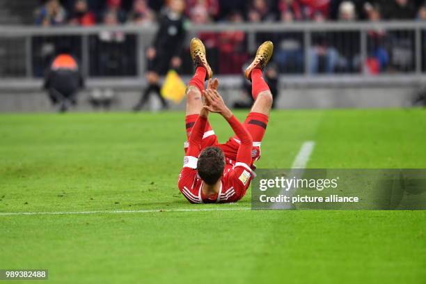 Bundesliga, Bayern Muenchen vs. 1. FC Koeln, 16th play day in the Allianz Arena in Munich, Germany, 13 December 2017. Thomas Müller of Bayern...