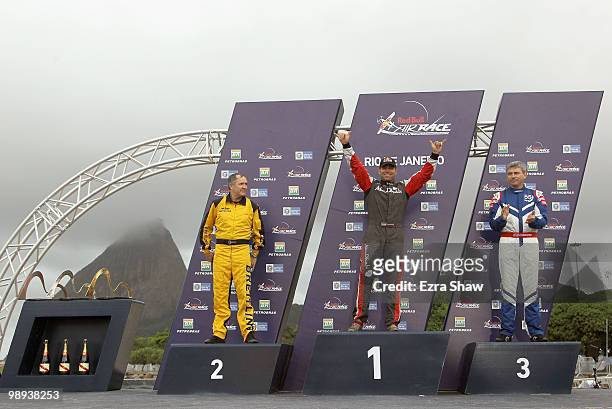 Hannes Arch of Austria celebrates his victory with Nigel Lamb of Great Britain who came 2nd and Paul Bonhomme of Great Britain 3rd on the podium...