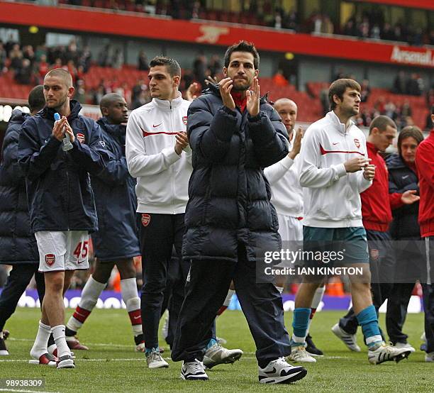 Arsenal's Spanish player Cesc Fabregas gestures to the crowd on the lap of appreciation after the English Premier League football match between...