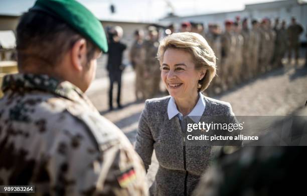 German Defence Minister Ursula von der Leyen talks while awarding an officer lieutenant colonel with field medals in the military camp Marmal in...