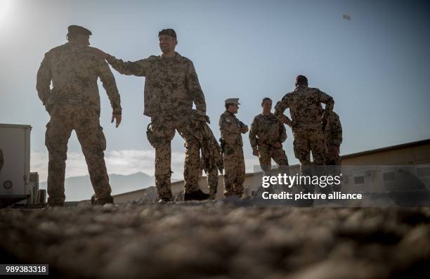 Soldiers of the German Armed Forces stand in the military camp Marmal in Masar-i-scharif in Afghanistan, 19 December 2017. Von der Leyen is in...