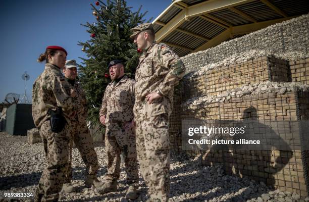 Soldiers of the German Armed Forces stand in the military camp Marmal in Masar-i-scharif in Afghanistan, 19 December 2017. Von der Leyen is in...