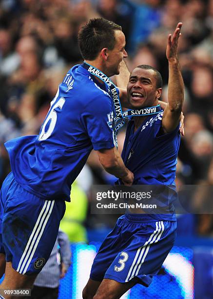 John Terry and Ashley Cole of Chelsea celebrate as they win the title after the Barclays Premier League match between Chelsea and Wigan Athletic at...