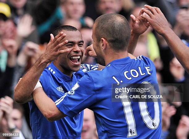 Chelsea's English defender Ashley Cole celebrates scoring their eighth goal with English midfielder Joe Cole during the English Premier League...