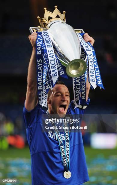 John Terry of Chelsea celebrates with the trophy after the Barclays Premier League match between Chelsea and Wigan Athletic at Stamford Bridge on May...