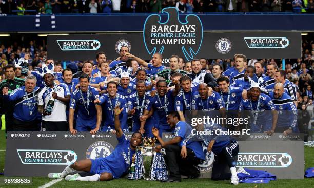 Chelsea's captain John Terry and his players celebrate with the trophy after winning the league with an 8-0 victory during the Barclays Premier...