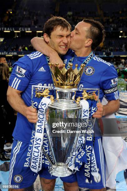 Branislav Ivanovic and John Terry of Chelsea celebrate with the trophy after winning the league with an 8-0 victory during the Barclays Premier...