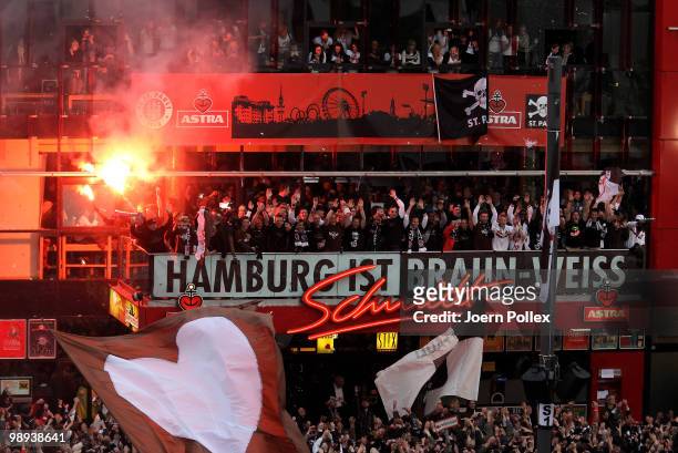 Thousands of St. Pauli fans celebrate together with the team of St. Pauli on the "Spielbudenplatz" after the Second Bundesliga match between FC St....