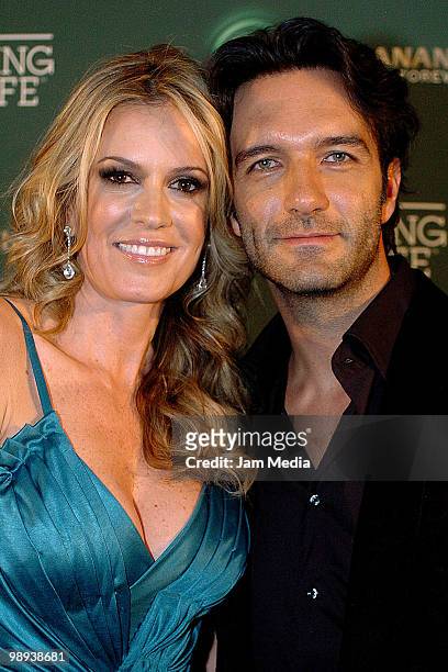 Tv personality Rebecca de Alba and singer Leonardo de Lozanne of group Fobia, pose for a photograph at the Green carpet of the Buchanan's Forever...