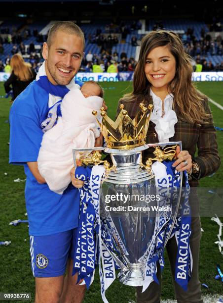 Joe Cole of Chelsea his wife Carly and daughter Ruby Tatiana celebrate with the trophy after winning the league with an 8-0 victory during the...