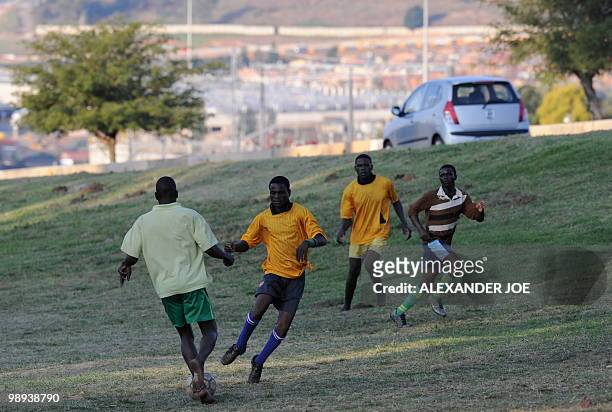 Group of boys from Alexandra township play football on a make shift ground off the main road in Marlboro on May 9, 2010. South Africa was awarded the...