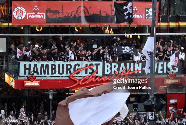 Thousands of St. Pauli fans celebrate together with the team of St. Pauli on the "Spielbudenplatz" after the Second Bundesliga match between FC St....