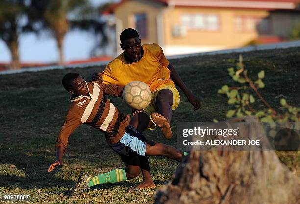 Group of boys from Alexandra township play football on a make shift ground off the main road in Marlboro on May 9, 2010. South Africa was awarded the...