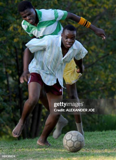 Group of boys from Alexandra township play football on a make shift ground off the main road in Marlboro on May 9, 2010. South Africa was awarded the...