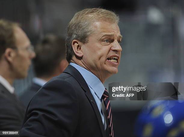 Sweden's head coach Bengt-Ake Gustafsson shouts instructions during the IIHF Ice Hockey World Championship match Norway vs Sweden in the southern...