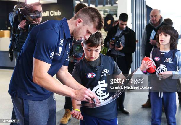 Marc Murphy of the Carlton Blues signs autographs for fans during a media opportunity at Ikon Park on July 2, 2018 in Melbourne, Australia.