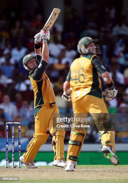 Cameron White of Australia smashes a six as Michael Hussey looks on during the ICC World Twenty20 Super Eight match between Sri Lanka and Australia...