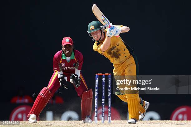 Alex Blackwell of Australia hits to the offside as Britney Cooper looks on during the ICC T20 Women's World Cup Group A match between Australia and...