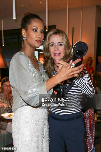 Model Marie Amiere and German presenter Bettina Cramer during the Ladies Dinner at Hotel De Rome on July 1, 2018 in Berlin, Germany.