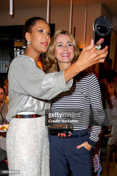 Model Marie Amiere and German presenter Bettina Cramer during the Ladies Dinner at Hotel De Rome on July 1, 2018 in Berlin, Germany.