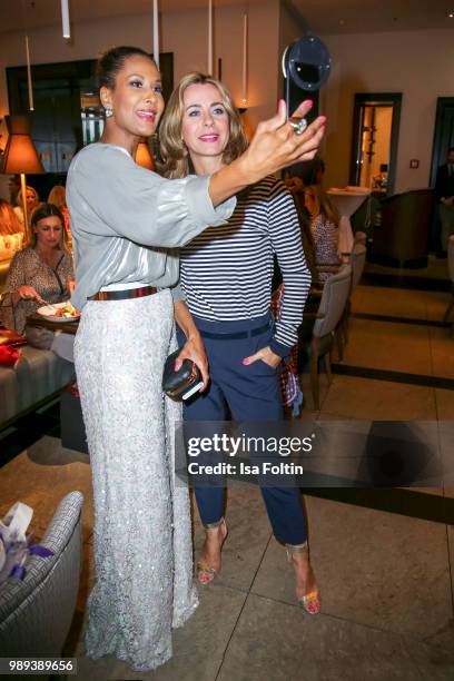 Model Marie Amiere and German presenter Bettina Cramer during the Ladies Dinner at Hotel De Rome on July 1, 2018 in Berlin, Germany.