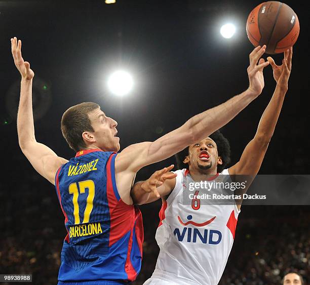 Josh Childress, #6 of Olympiacos Piraeus competes with Fran Vazquez, #17 of Regal FC Barcelona in action during the Euroleague Basketball Final Four...