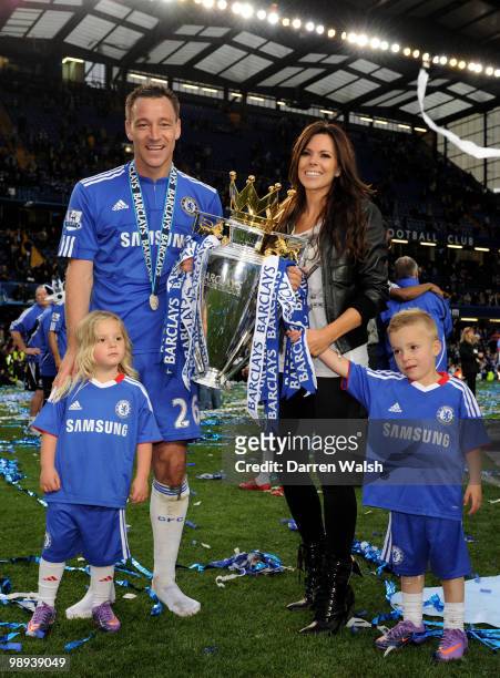 Chelsea captain John Terry, his wife Toni and their children celebrate with the trophy after winning the league with an 8-0 victory during the...