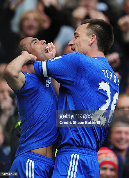 Ashley Cole of Chelsea celebrates with John Terry as he scores their eighth goal during the Barclays Premier League match between Chelsea and Wigan...