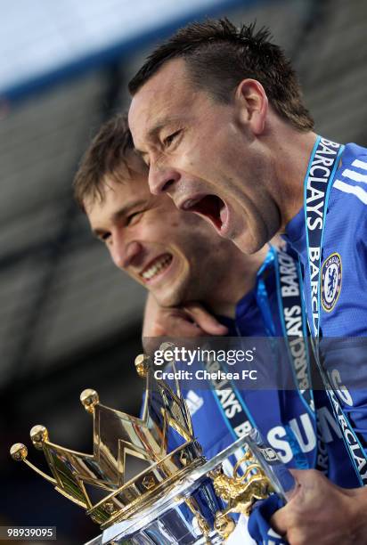 Branislav Ivanovic and John Terry of Chelsea celebrate with the trophy after winning the league with an 8-0 victory during the Barclays Premier...