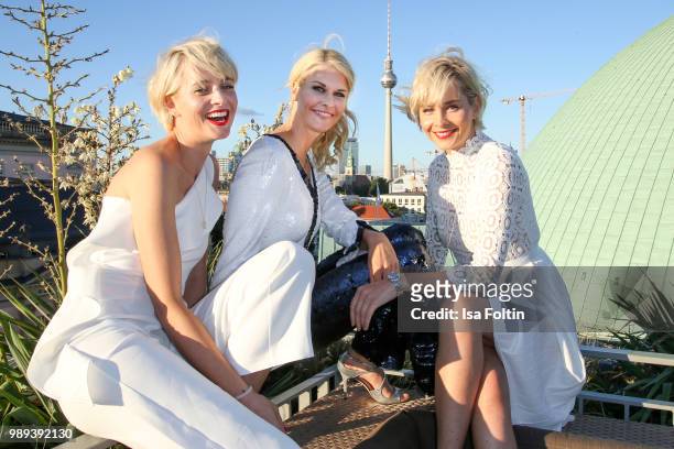 Advertising twins Julia Meise and Nina Meise with Natascha Gruen during the Ladies Dinner at Hotel De Rome on July 1, 2018 in Berlin, Germany.