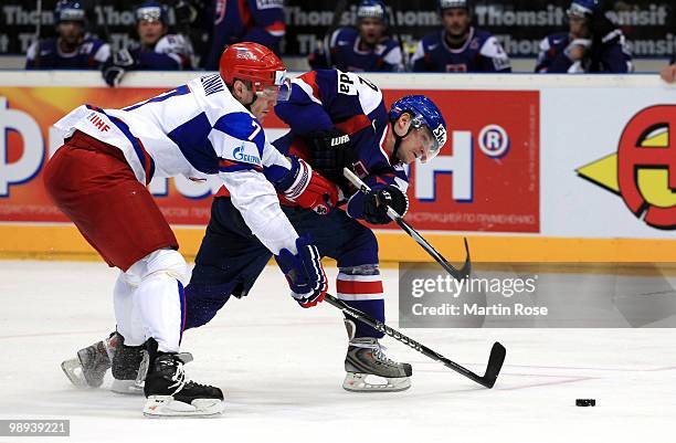 Ivan Ciernik of Slovakia and Dmitri Kalinin of Russia battle for the puck during the IIHF World Championship group A match between Slovakia and...