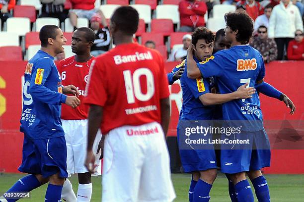 Soccer player Kleber of Cruzeiro celebrates his scored goal with team mate Pedro Ken during a match against Internacional as part of the Brazilian...
