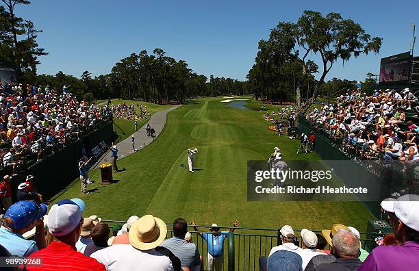 Ben Crane plays his tee shot on the first hole while Lucas Glover looks on during the final round of THE PLAYERS Championship held at THE PLAYERS...