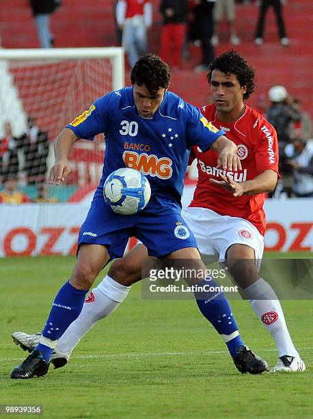 Soccer player Ronaldo Alves of Internacional fights for the ball with Kleber of Cruzeiro during a match as part of the Brazilian Championship at...