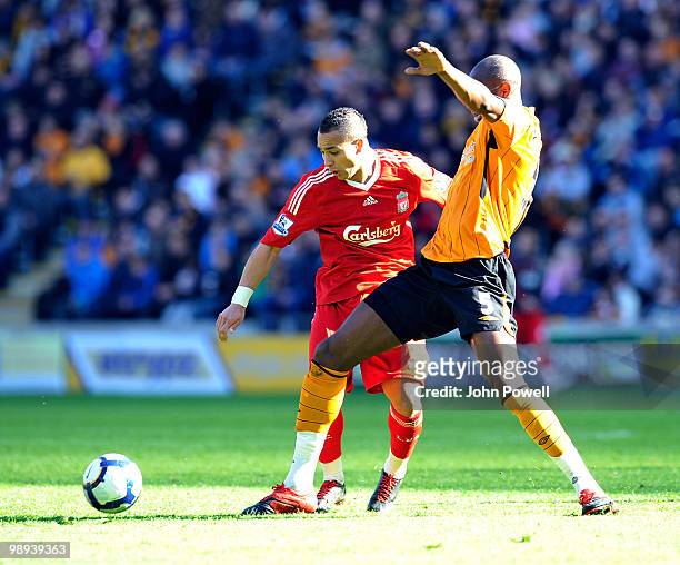Nabil El Zhar of Liverpool competes with Andy Dawson of Hull City during the Barclays Premier League match between Hull City and Liverpool at KC...