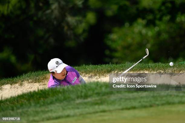 Shanshan Feng of China chips her shot from the sand trap on the sixth hole during the final round of the KPMG Women's PGA Championship on July 1,...