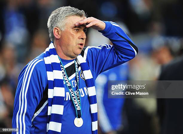 Carlo Ancelotti manager of Chelsea looks on as they win the title after the Barclays Premier League match between Chelsea and Wigan Athletic at...